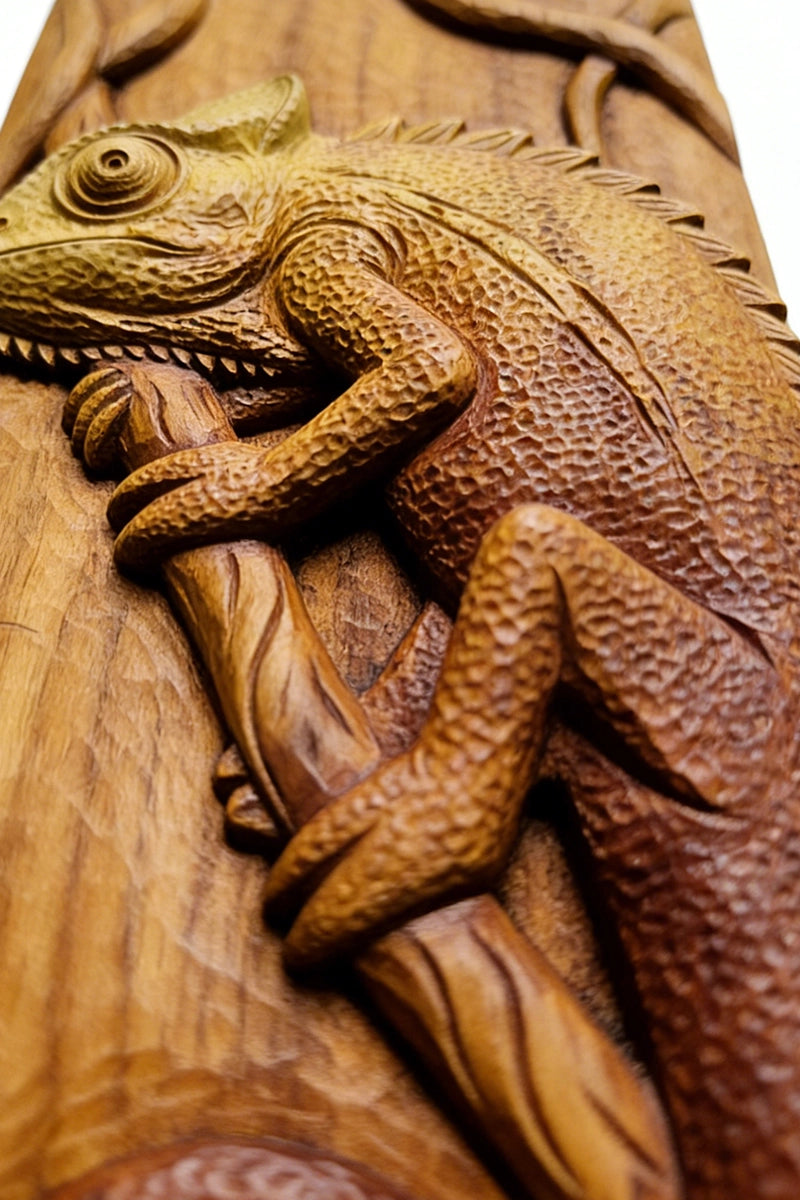 Chameleon wood carving detail showing textured scales and chisel marks