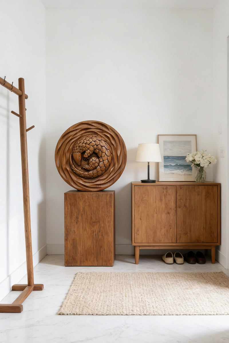 Pangolin round wood relief displayed on living room wall