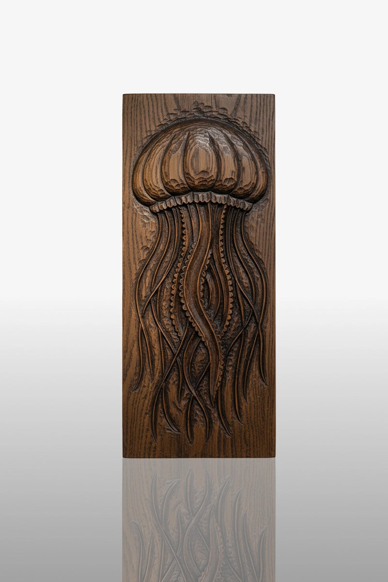 Hand-carved jellyfish relief in camphor wood with flowing tentacles and domed bell