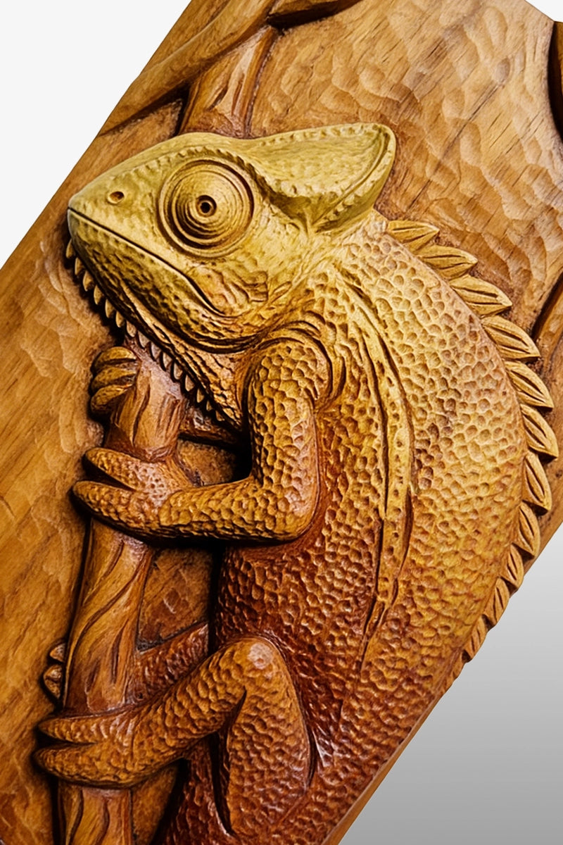 Chameleon wood carving detail showing textured scales and chisel marks