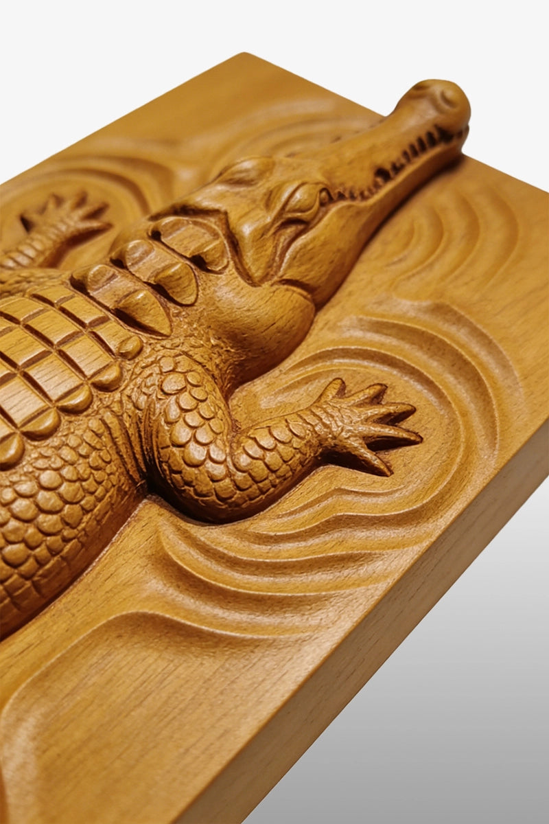 Crocodile wood carving detail showing dorsal scales and claw texture
