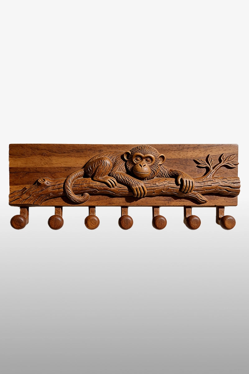 Hand-carved monkey coat rack in camphor wood with 7 wooden hooks, monkey resting on branch