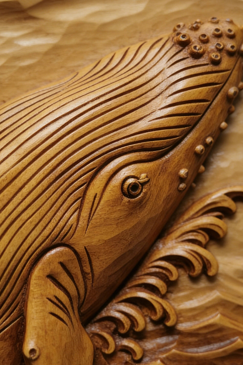 Hand-carved humpback whale relief in natural camphor wood with ocean wave details, 19 x 19 inches
